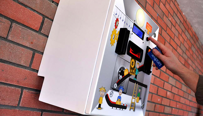 Person using TouchTopUp hardware secured to the wall